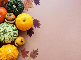 Pumpkins on a light brown background photo